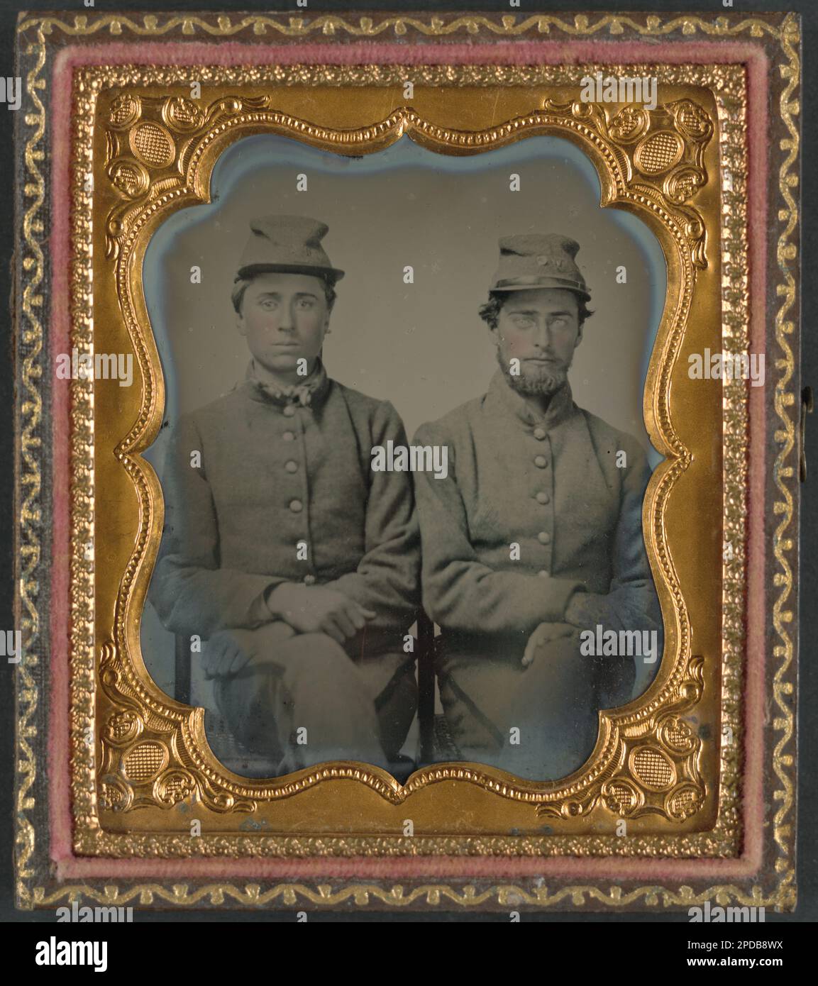 Two unidentified soldiers in Confederate uniforms and hats marked W.G ...