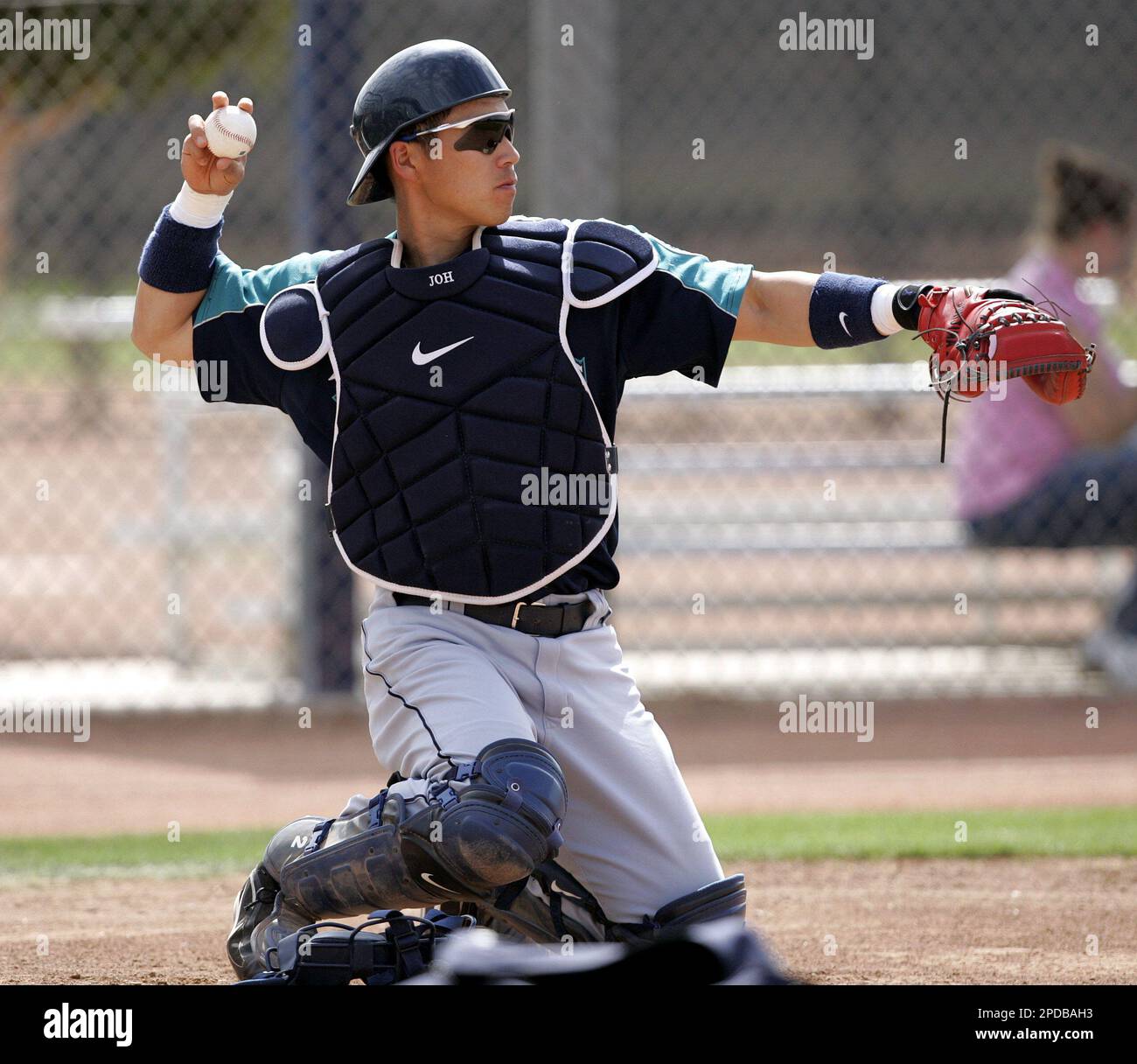 Seattle Mariners catcher Kenji Johjima throws at MLB baseball
