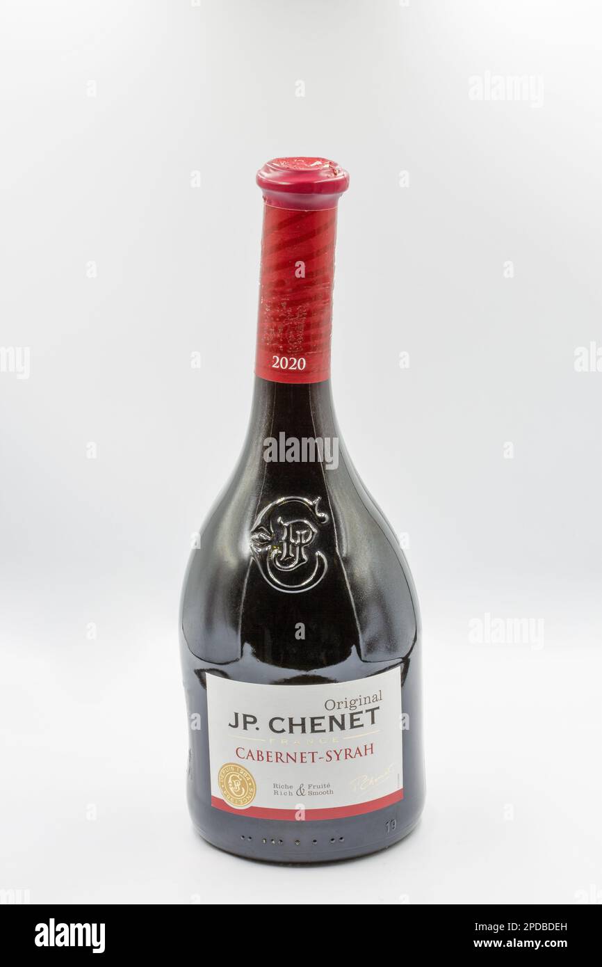 Kyiv, Ukraine - May 26, 2022: Studio shoot of JP. Chenet Cabernet-Syrah red dry wine bottle closeup on white. JP Chenet is a French wine brand bottled Stock Photo