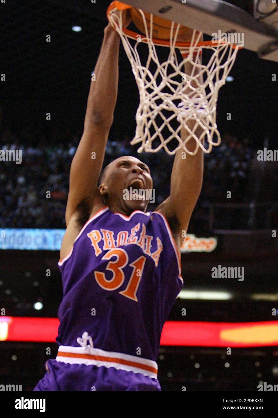 Phoenix Suns forward Shawn Marion slam dunks the basketball against the