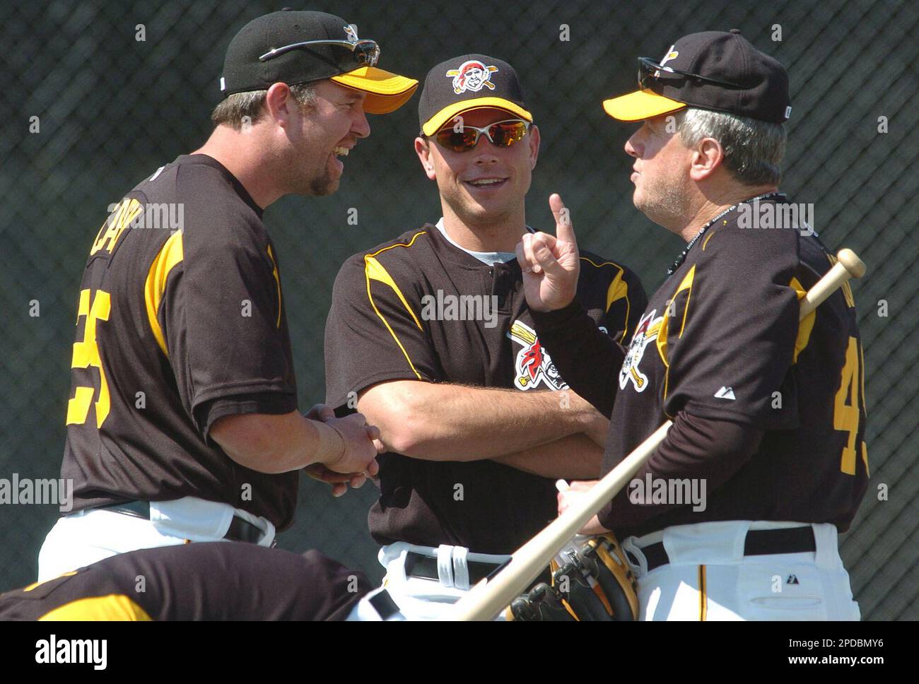 Pittsburgh Pirates' Joe Randa (5) rounds third to greetings from