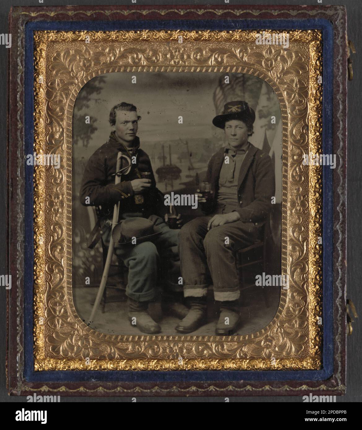 Two unidentified soldiers in Union cavalry uniforms with sword share a ...