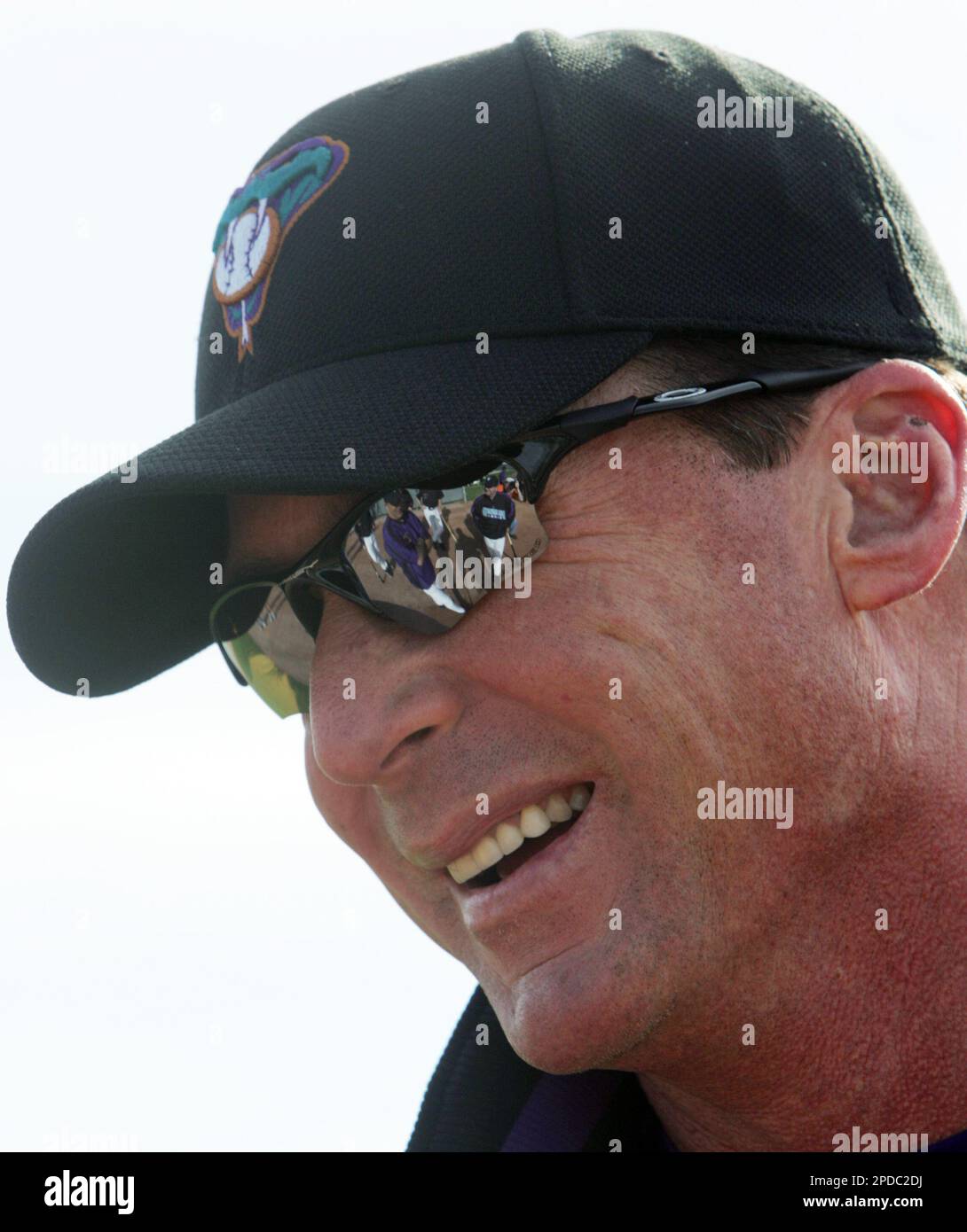 Arizona Diamondbacks manager Bob Melvin laughs with his coaching staff