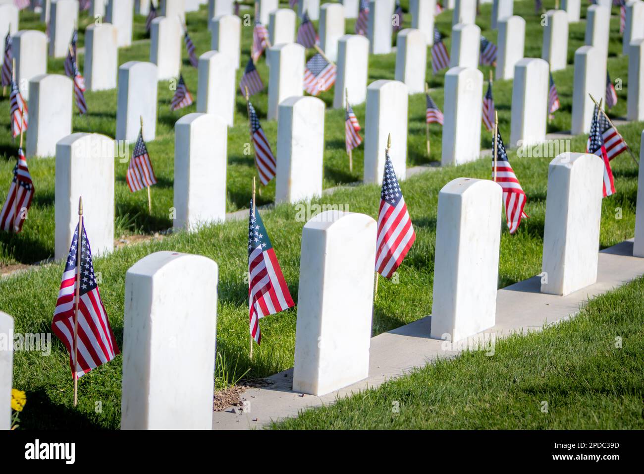 Military headstones honoring armed forces servicemen decorated with ...