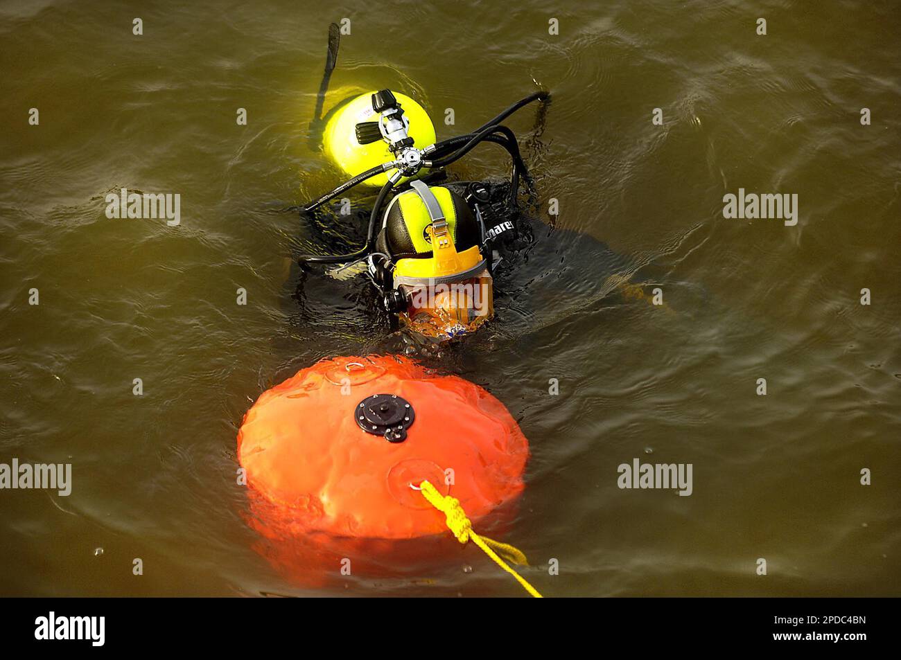 A Spotsylvania County dive team member maneuvers a flotation device in ...