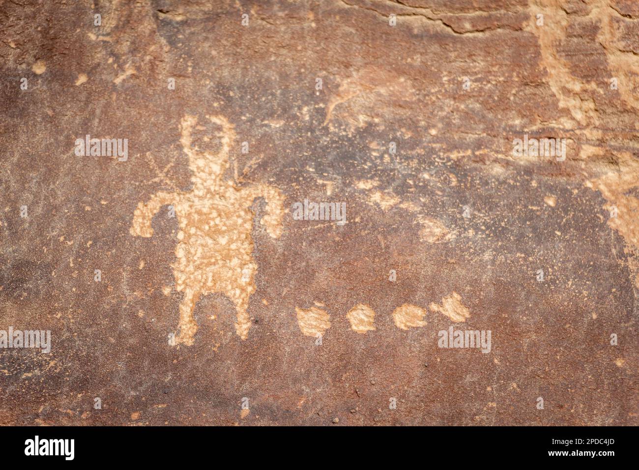 Petroglyph of person with horns rock drawing on sandstone in Price, Utah Stock Photo