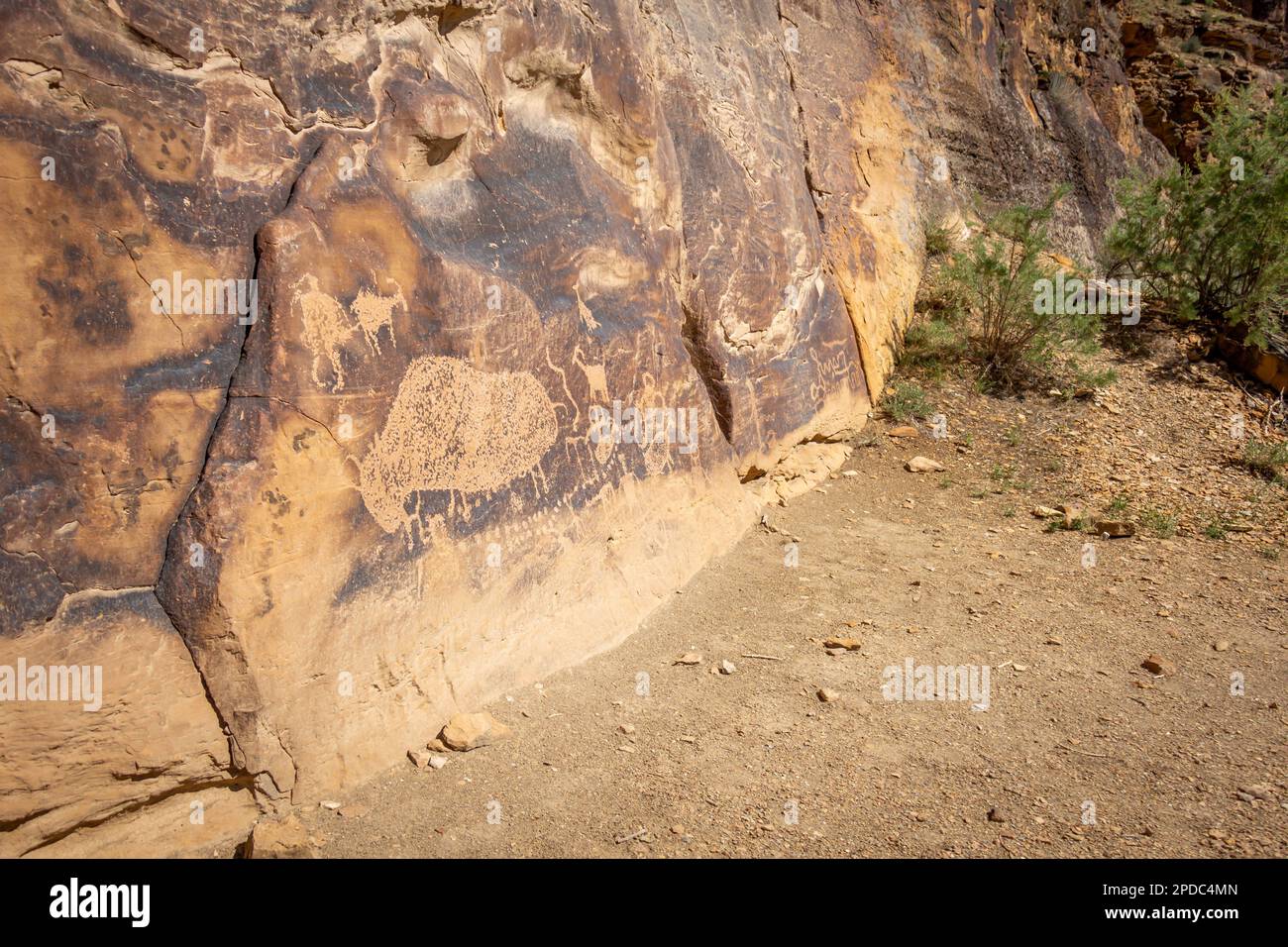 Sandstone rock wall with indigenous people petroglyphs in Price, Utah Stock Photo