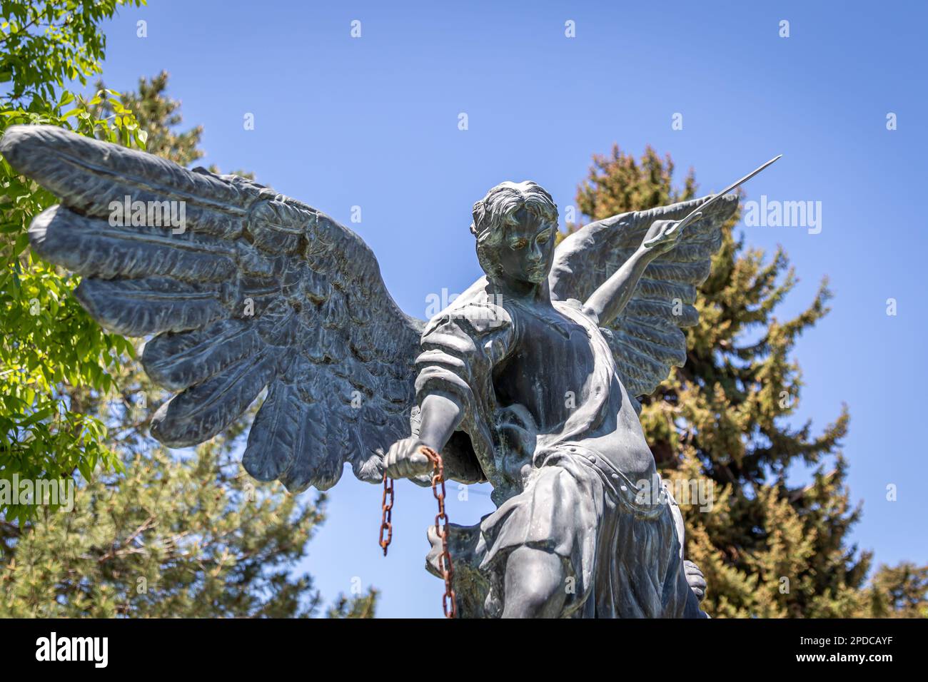 Statue of Micheal the Archangel statue holding a sword at the cemetery ...