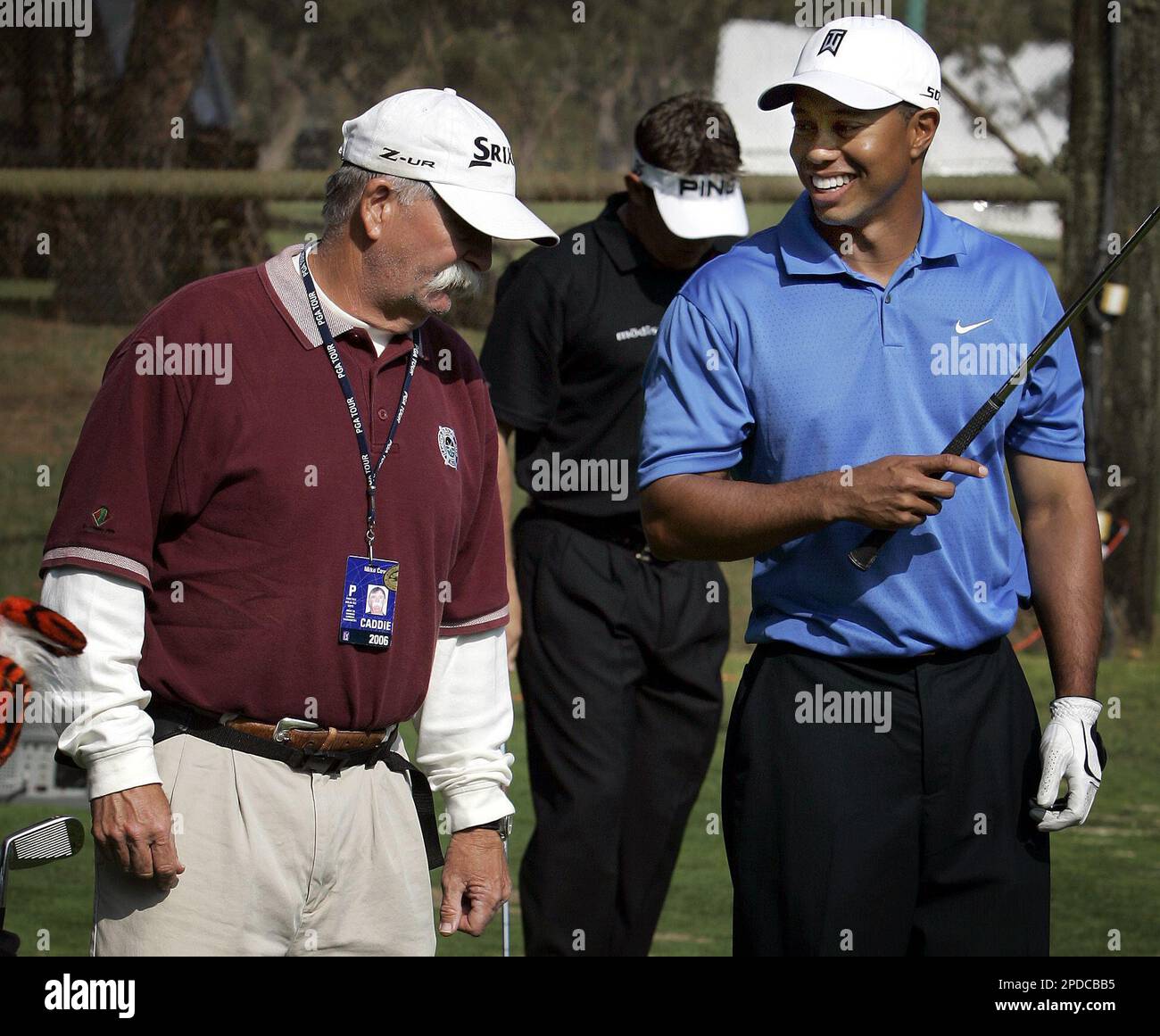 Tiger Woods, right, shares a moment with his former caddy Fluff Cowan