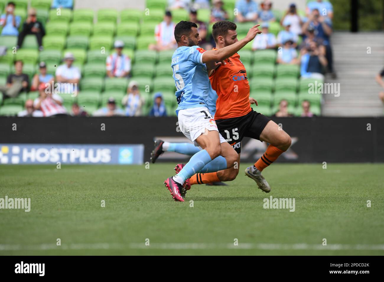 MELBOURNE, AUSTRALIA. 12 March, 2023. Melbourne City v Brisbane Roar. Melbourne's Andrew Nabbout (left) goes head to head with Roar's Jesse Daley Stock Photo