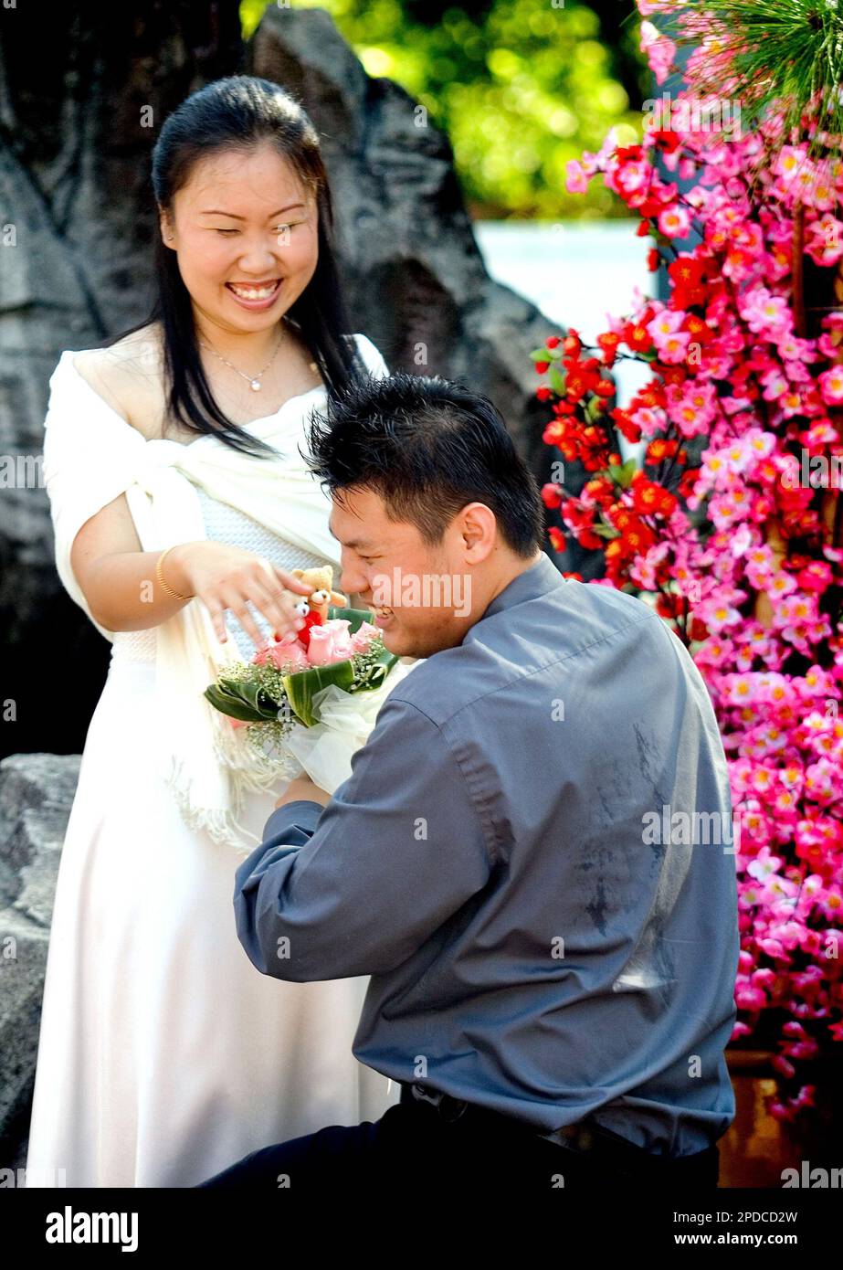 A Malaysian couple shares a light moment on Valentine's Day, Tuesday, Feb. 14, 2006 in Kuala
