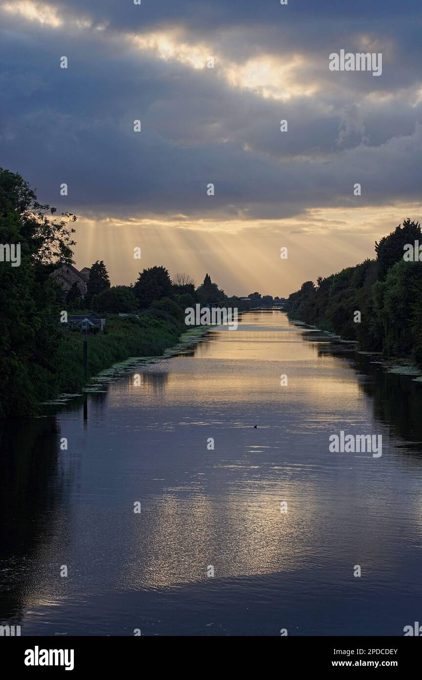 stunning view of the South Forty-foot drain with sun rays shining through the clouds Stock Photo