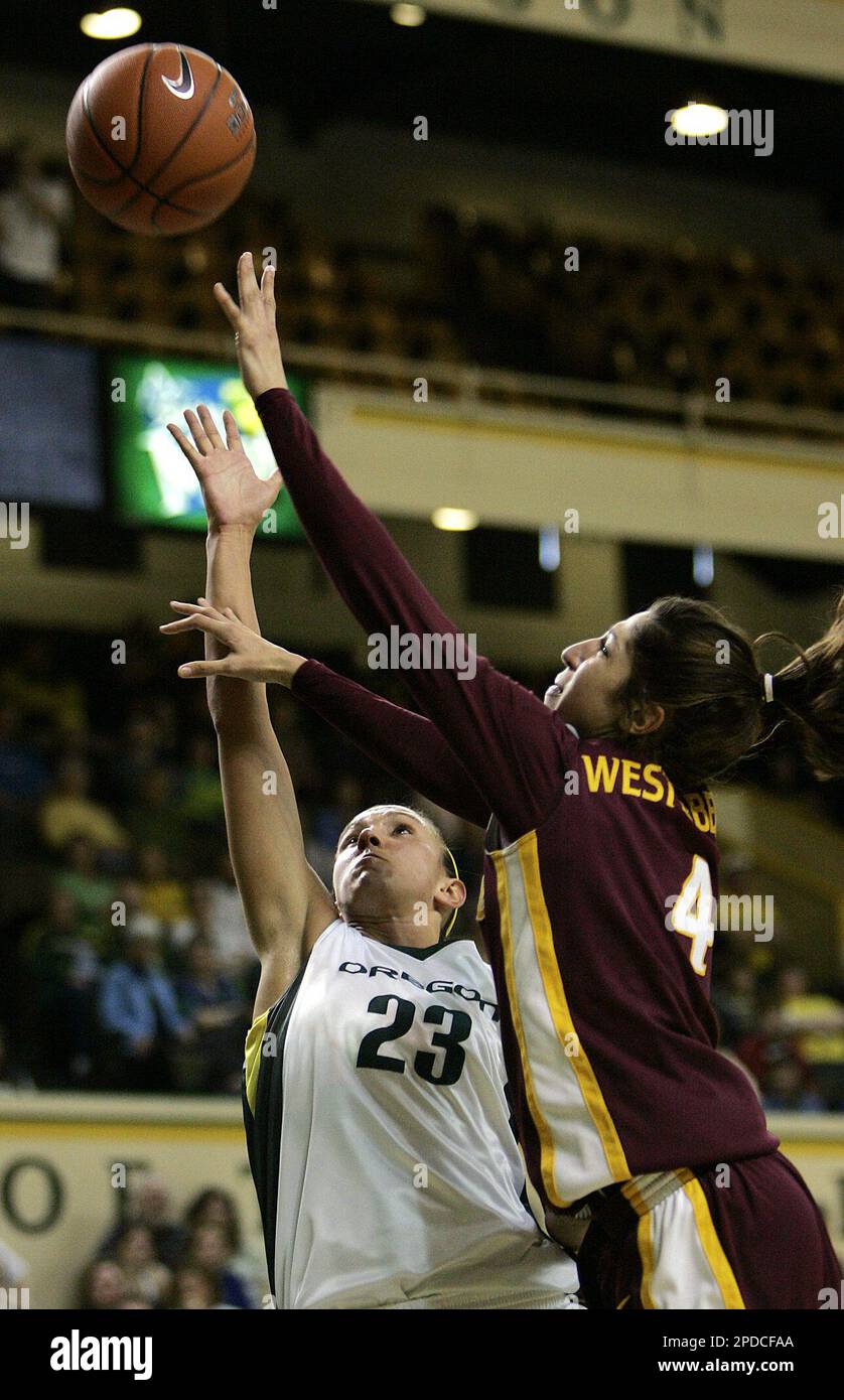 Arizona State 's Emily Westerberg, right, goes to the hoop against
