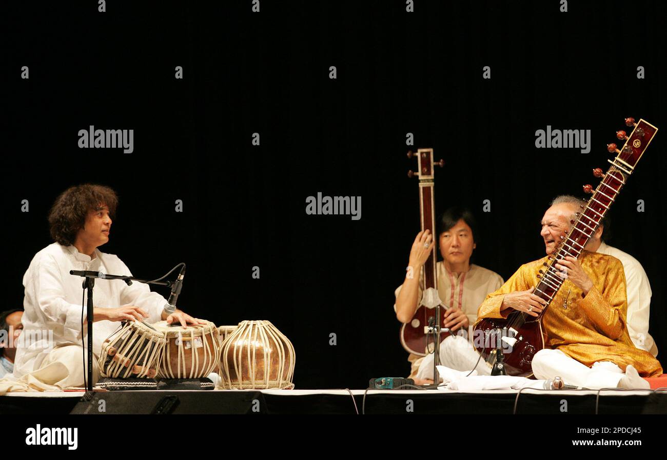 Indian musical maestros, Ustad Zakir Hussain, left, and Pandit Ravi