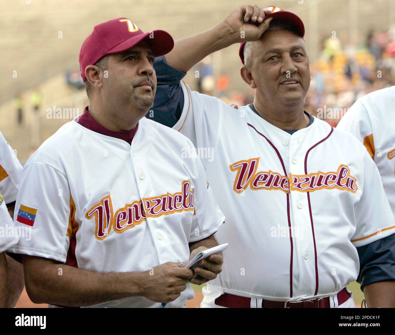 Venezuela's manager Luis Sojo, left, and bench coach David Concepcion smile  during a practice session of the Venezuelan Baseball National team at the  University stadium in Caracas, Venezuela, Saturday, Feb. 11, 2006.