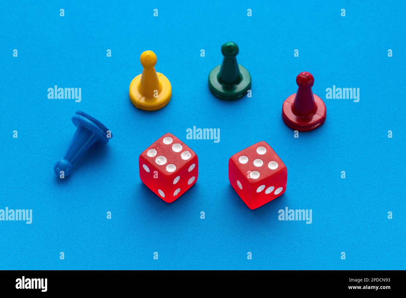 Board game pieces and dice Blue eva rubber background Stock Photo Alamy