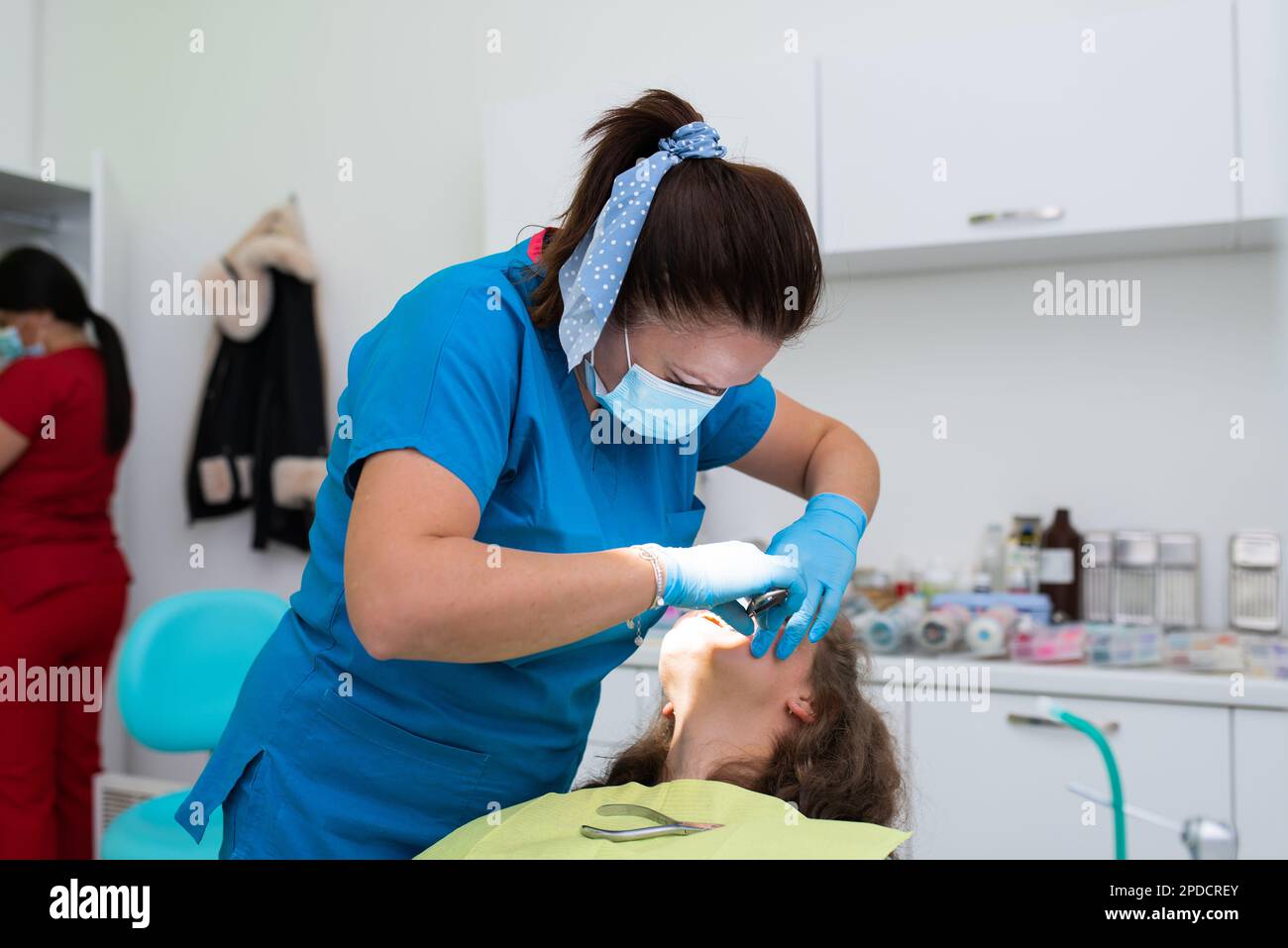 Dentist appointment at a dental clinic, placing braces locks on the