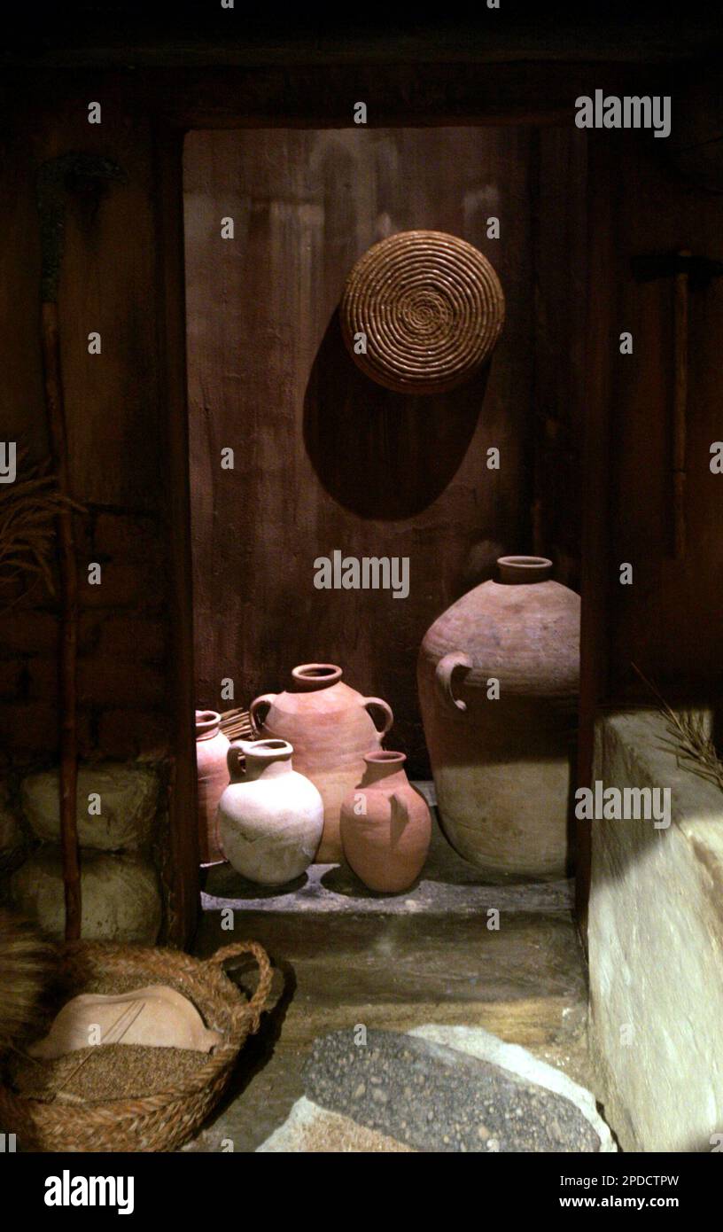 Ceramics of Iron Age are seen inside of a replica of an Iron Age