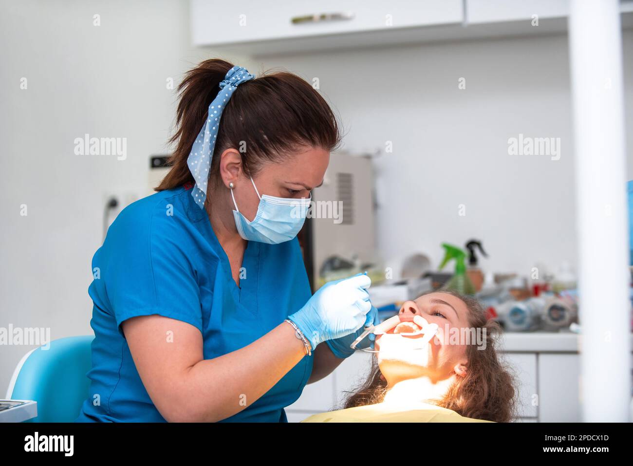 Dentist appointment at a dental clinic, placing braces locks on the