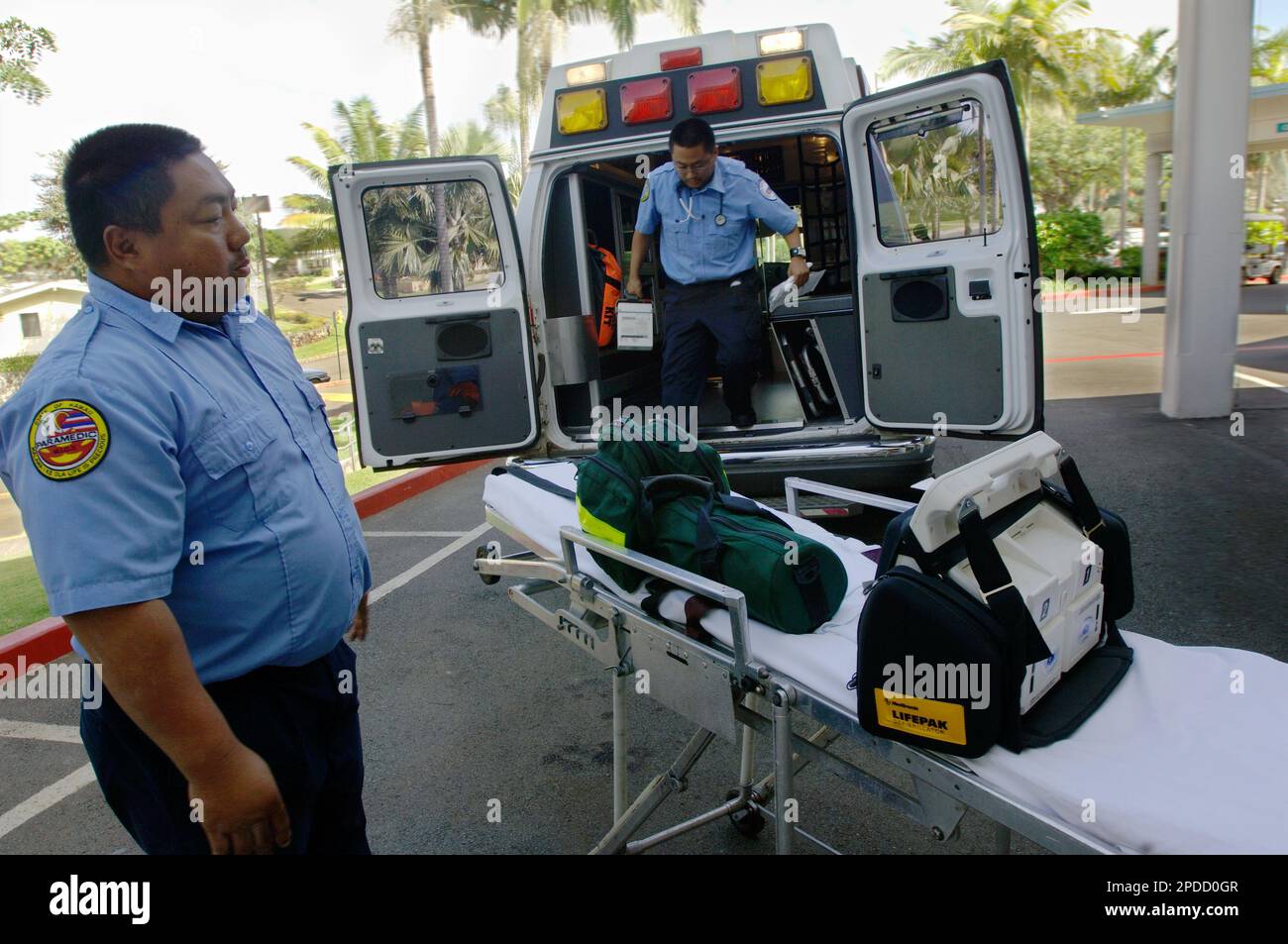 Paramedic Mopas and Gerald Raquel, an EMT with American Medical Response, unload their ambulance in front of Castle Medical Center in Kailua, Hawaii, Monday, Feb. 2006. Thicker traffic, sprawling communities