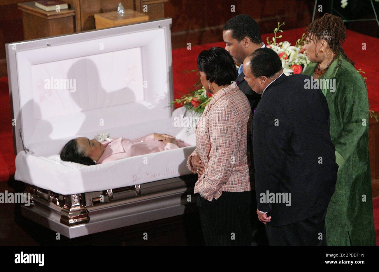 From left to right, Rev. Bernice King, Dexter Scott King, Martin Luther King  III and Yolanda King, stop in front of the casket of their mother Coretta  Scott King as she lies