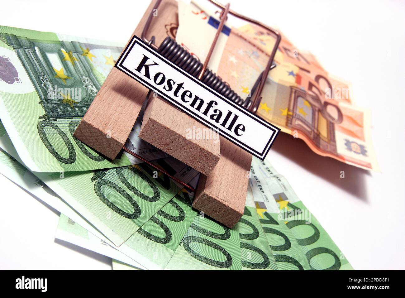 wooden mousetrap with Euro bills and sign lettering Kostenfalle, cost