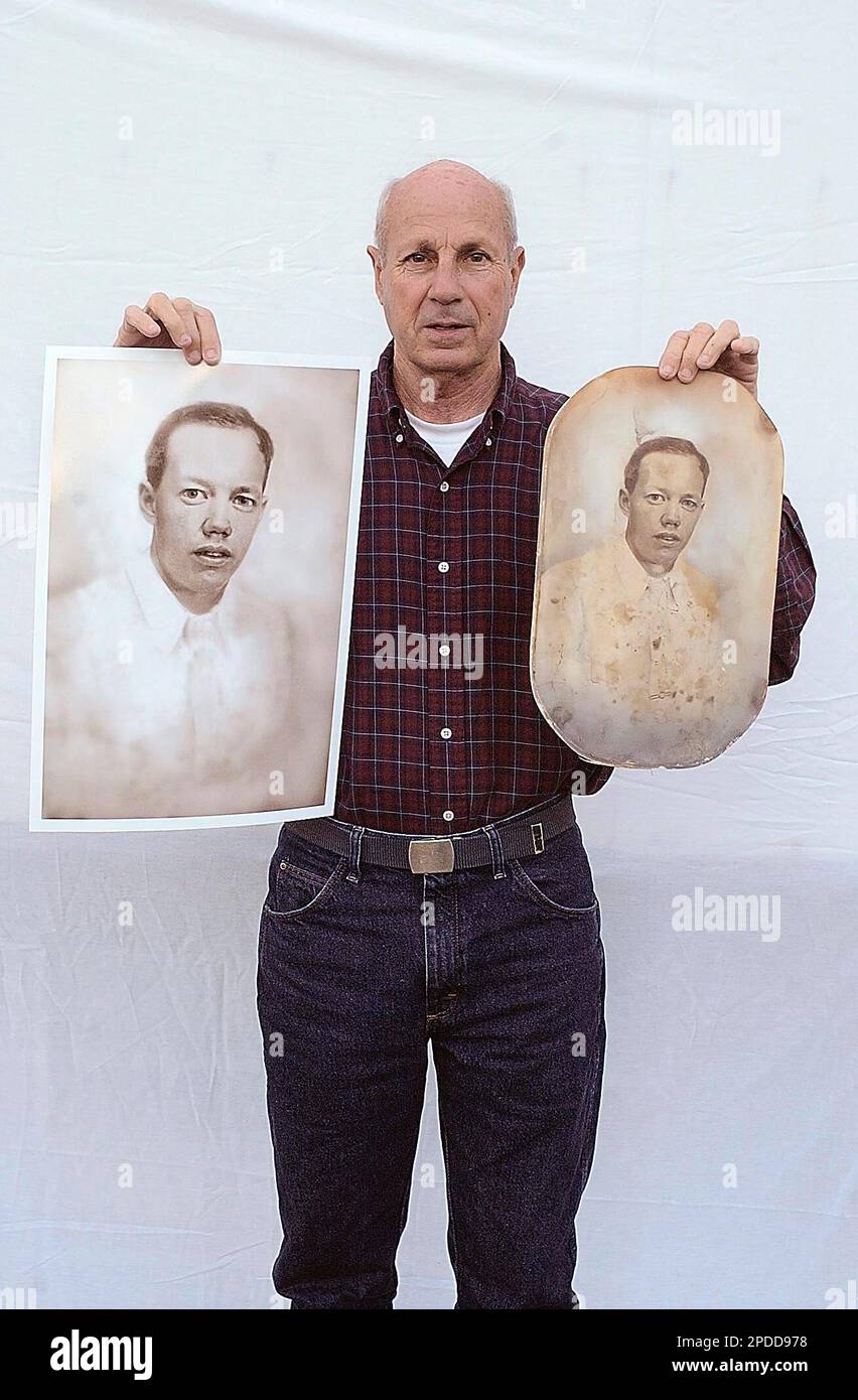 Harry Stegenga, of Pass Christian, Miss., displays a photo of his