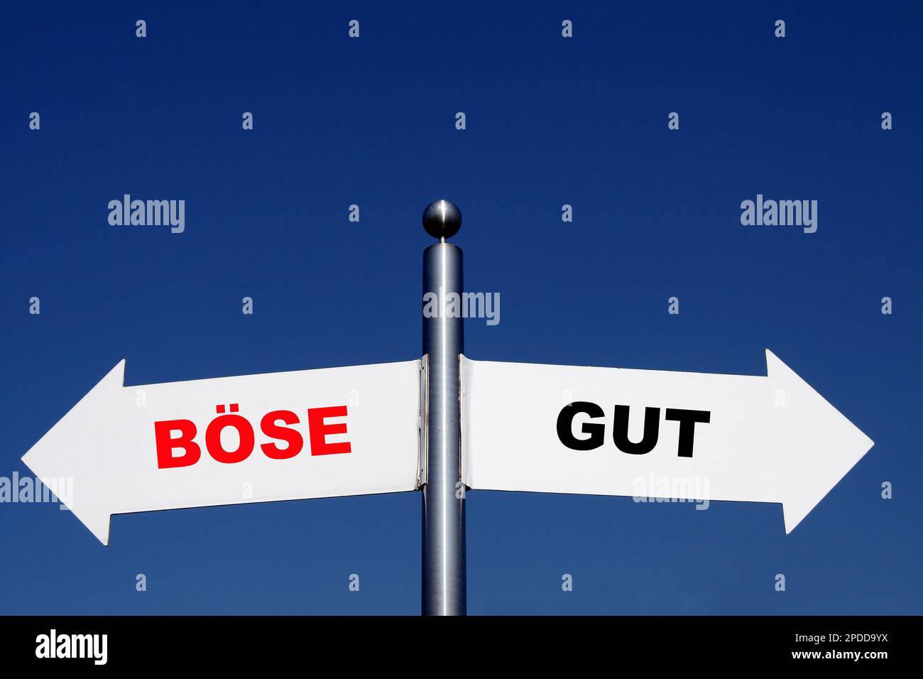 signposts pointing in different directions, options boese - gut, bad - good Stock Photo