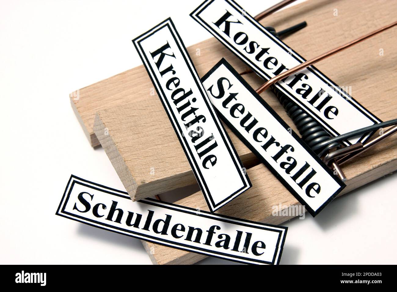 wooden mousetrap with sign lettering Kostenfalle, Steuerfalle