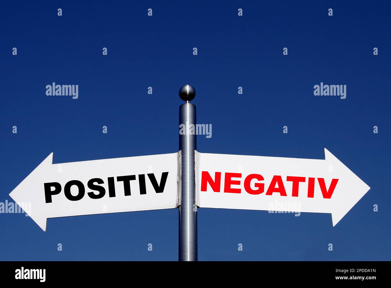 signposts pointing in different directions, options positiv - negativ Stock Photo