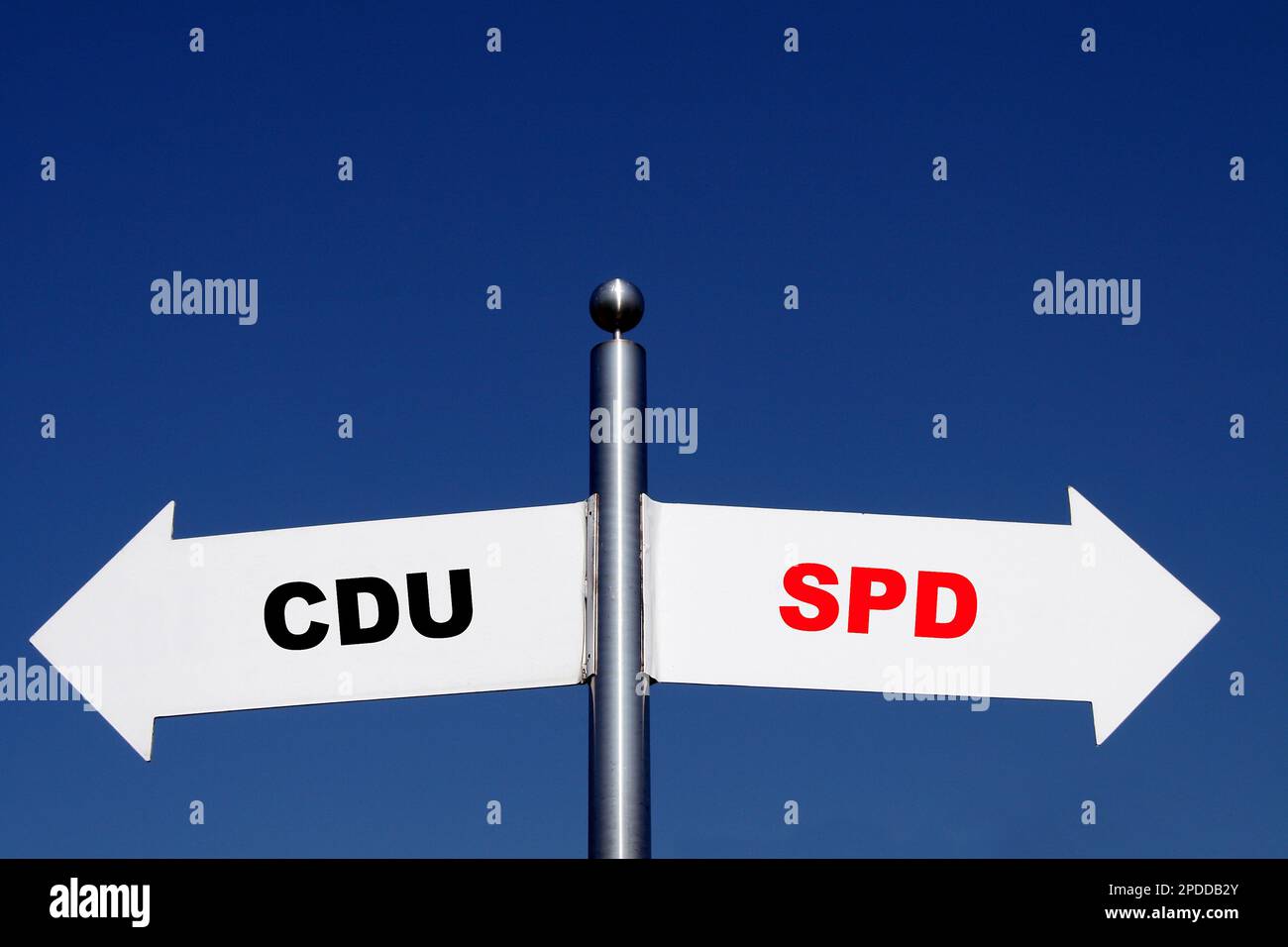 signposts pointing in different directions, options CDU - SPD Stock Photo