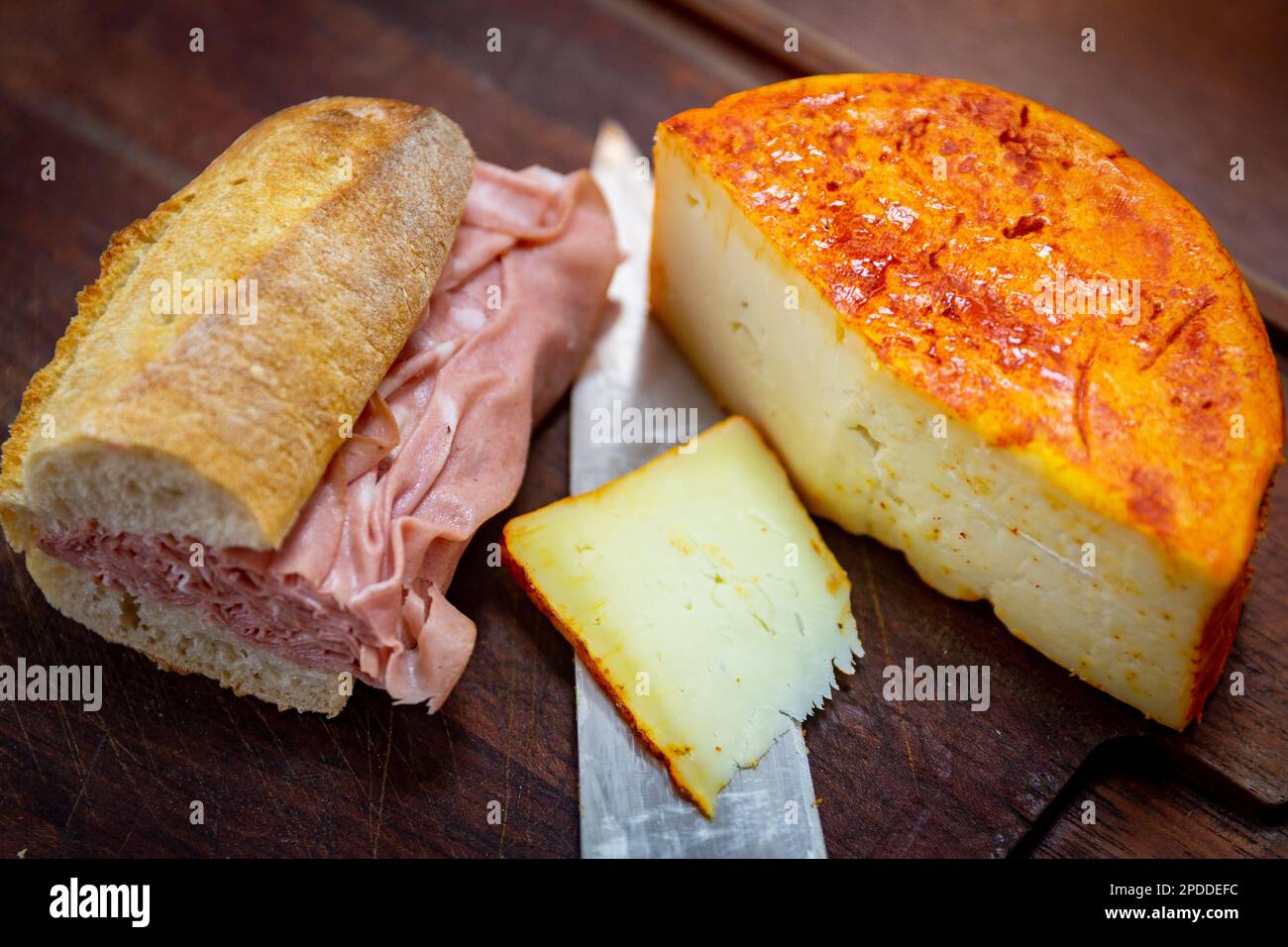 Traditional mortadella sandwich in a rustic setting, selective focus