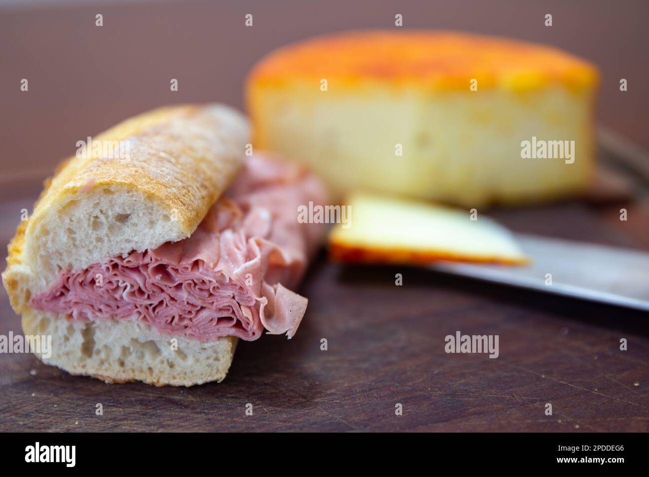 Traditional mortadella sandwich in a rustic setting, selective focus