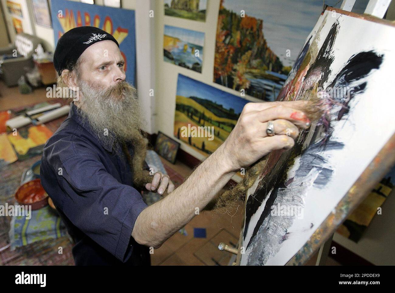Marco Figgen, a German artist, paints with his beard at his studio in  Pattaya city of Chonburi province, central Thailand, Wednesday, Feb. 1,  2006. Figgen, 50, of Essen, Germany, is a unique