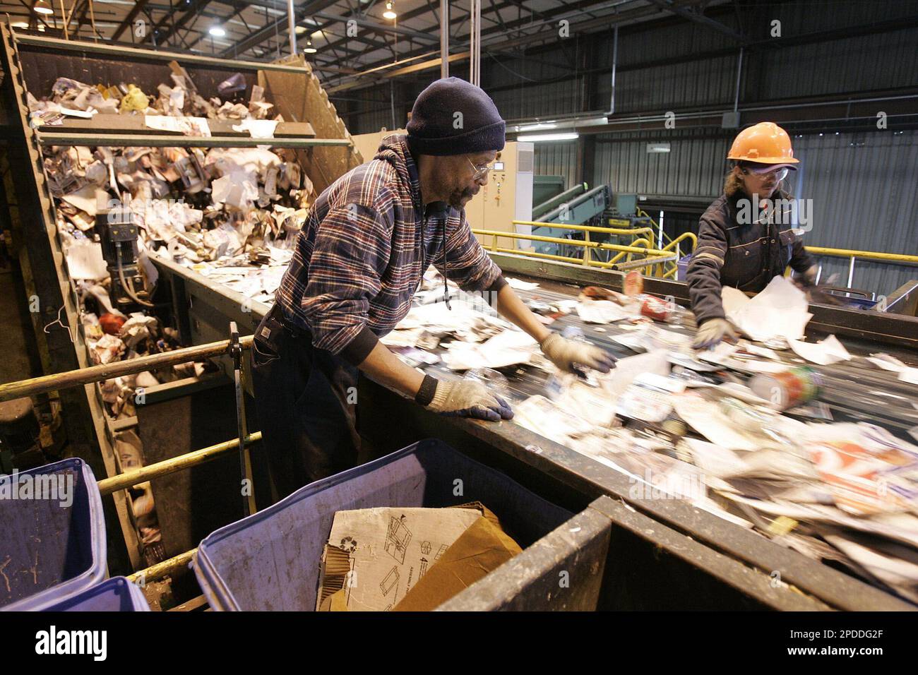 Harris,left, and Jerry Jones, right, work on the sorting line at