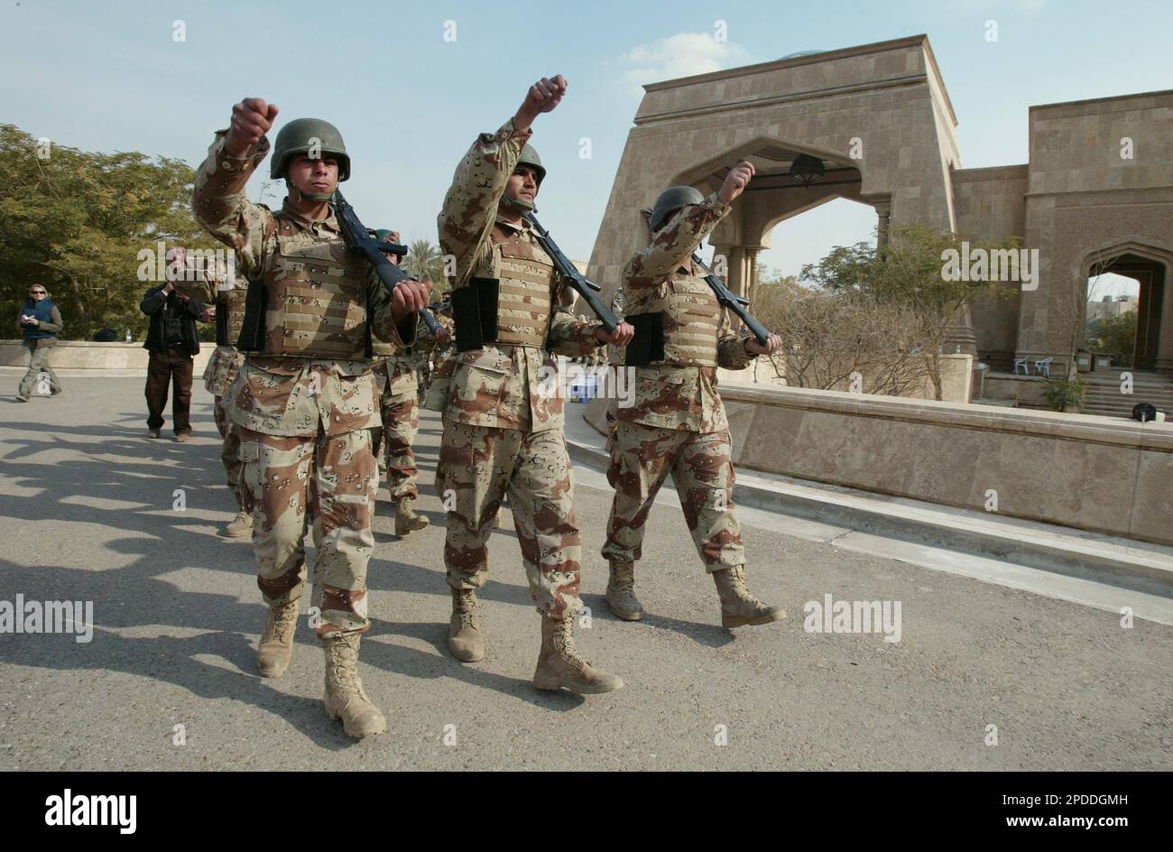 Iraqi soldiers of the 5th Brigade march during a transition of