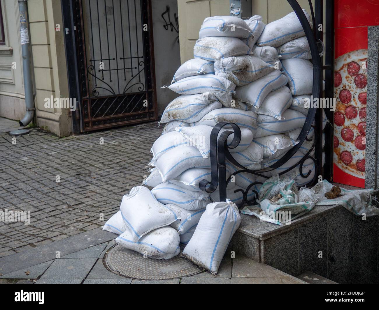 Bags with building materials on the street. Preparing to refurbish the store. Building mix bags