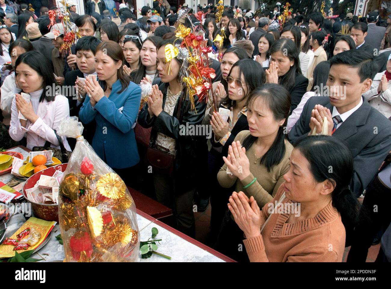 Vietnamese worshippers pray at a shrine of the Phu Tay Ho pagoda on the