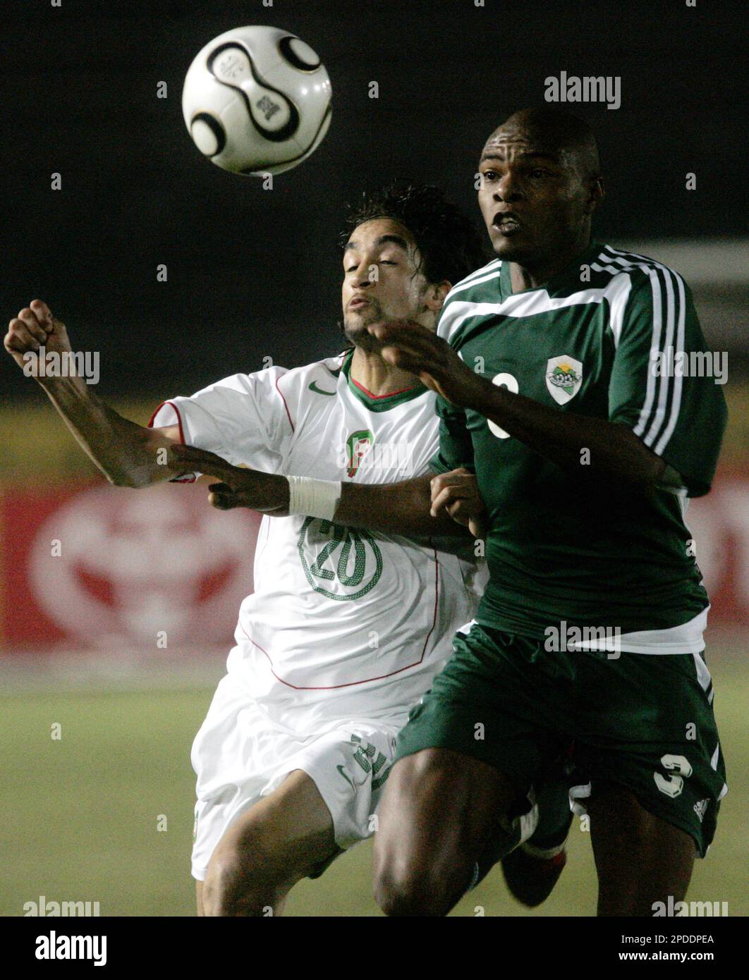 Youssef Hadji of Morocco, left, and Naji Shushan of Libya fight for the  ball during the African Nations Cup Group A soccer match between Morocco  and Libya at the Military Academy stadium