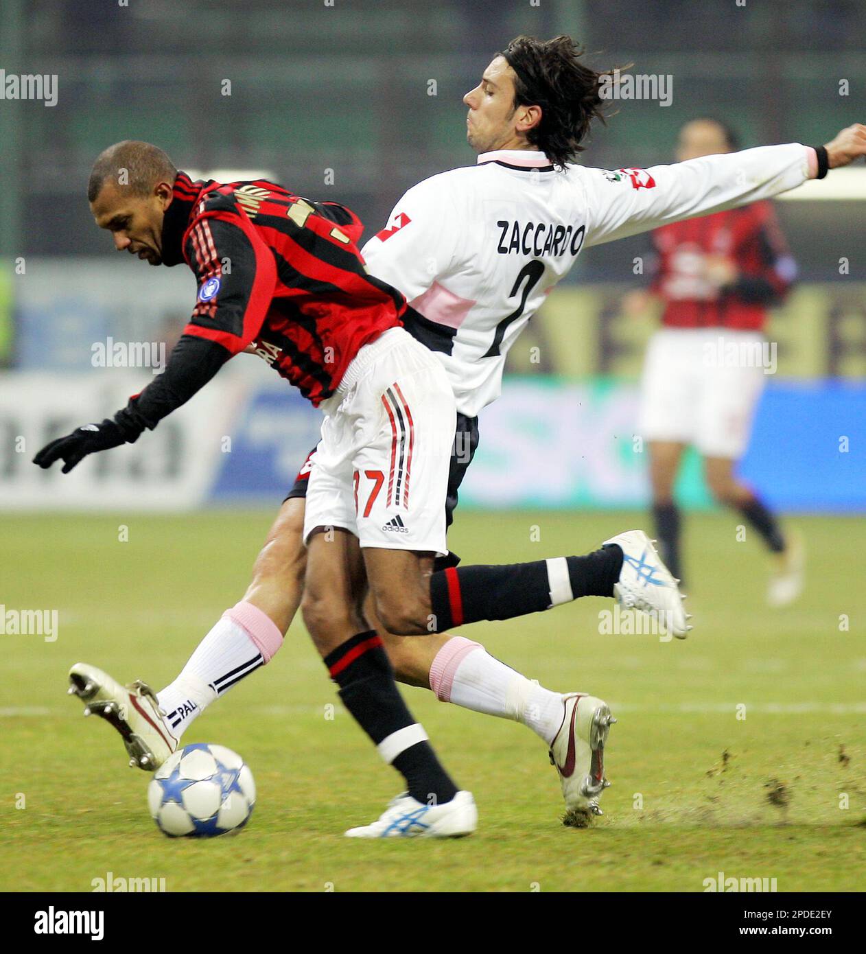AC Milan Brazilian forward Marcio Amoroso, left, and Palermo defender  Cristian Zaccardo compete for the ball during their Italian Cup soccer  match at the San Siro stadium in Milan, Italy, Wednesday, Jan.