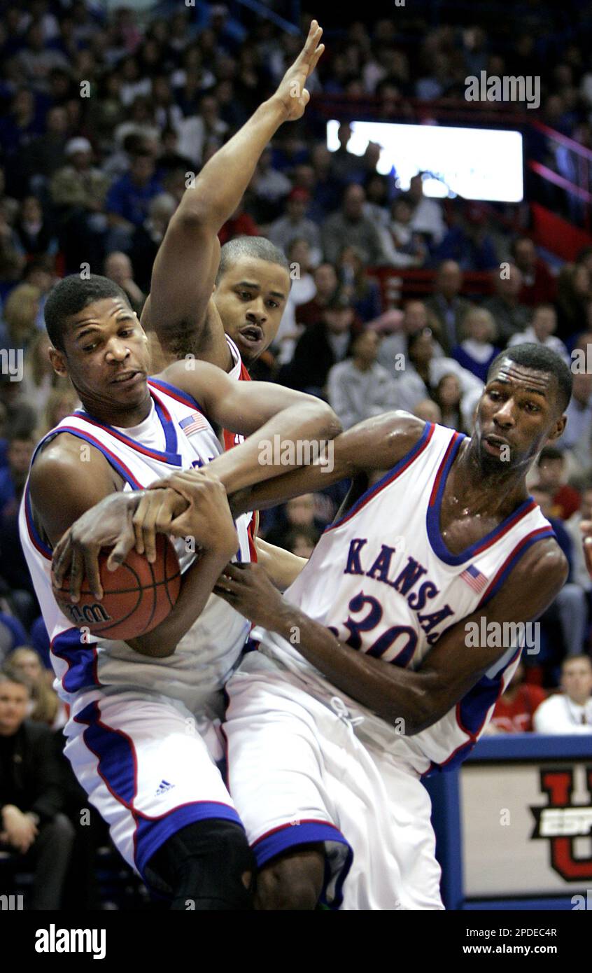 Kansas' C.J. Giles, left, and Julian Wright (30) beat Nebraska 