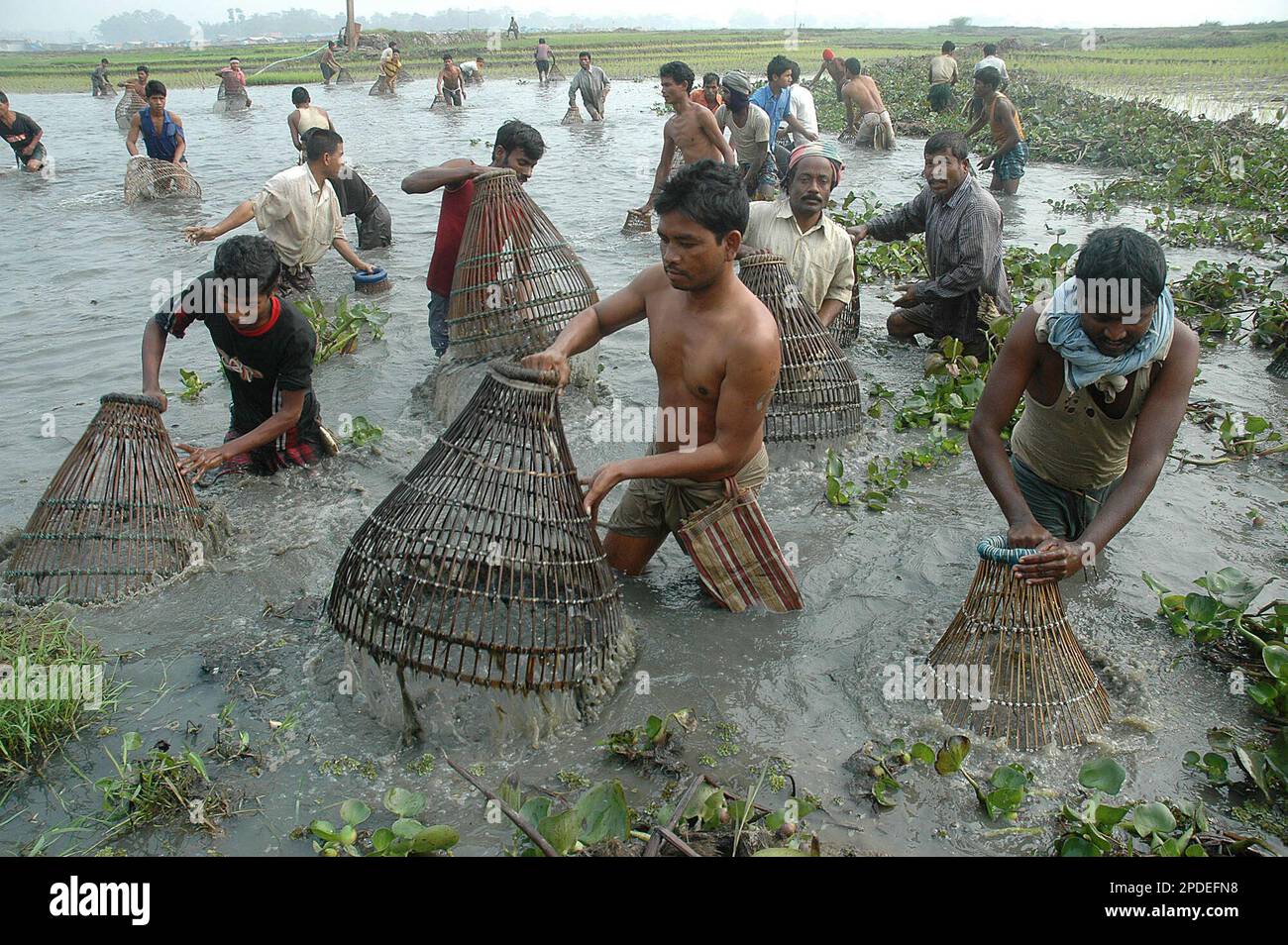 Tiwa tribals, who live along the Karbi Anglong hills, catch fish with traditional fishing tools during a community fishing session at the festival of Jonbeel Mela near Jagirod, 65 kilometers (40 miles) Tiwa tribals, who live along the Karbi Anglong hills, catch fish with traditional fishing tools during a community fishing session at the festival of Jonbeel Mela near Jagirod, 65 kilometers (40 miles)