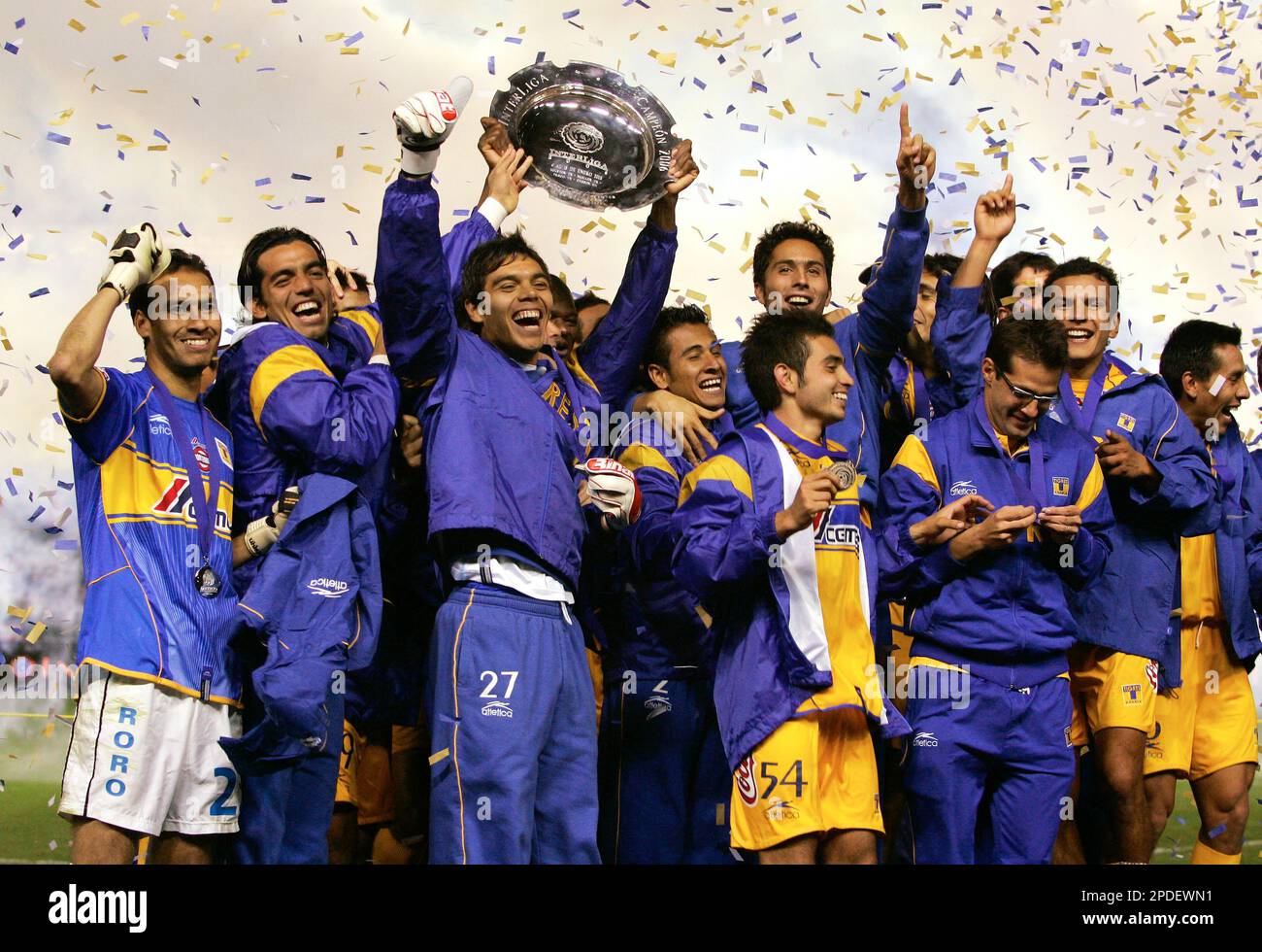 Team Tigres celebrates as they hold up the interliga trophy after ...