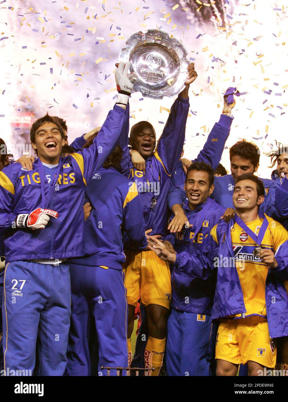 Team Tigres celebrates as they hold up the interliga trophy after ...