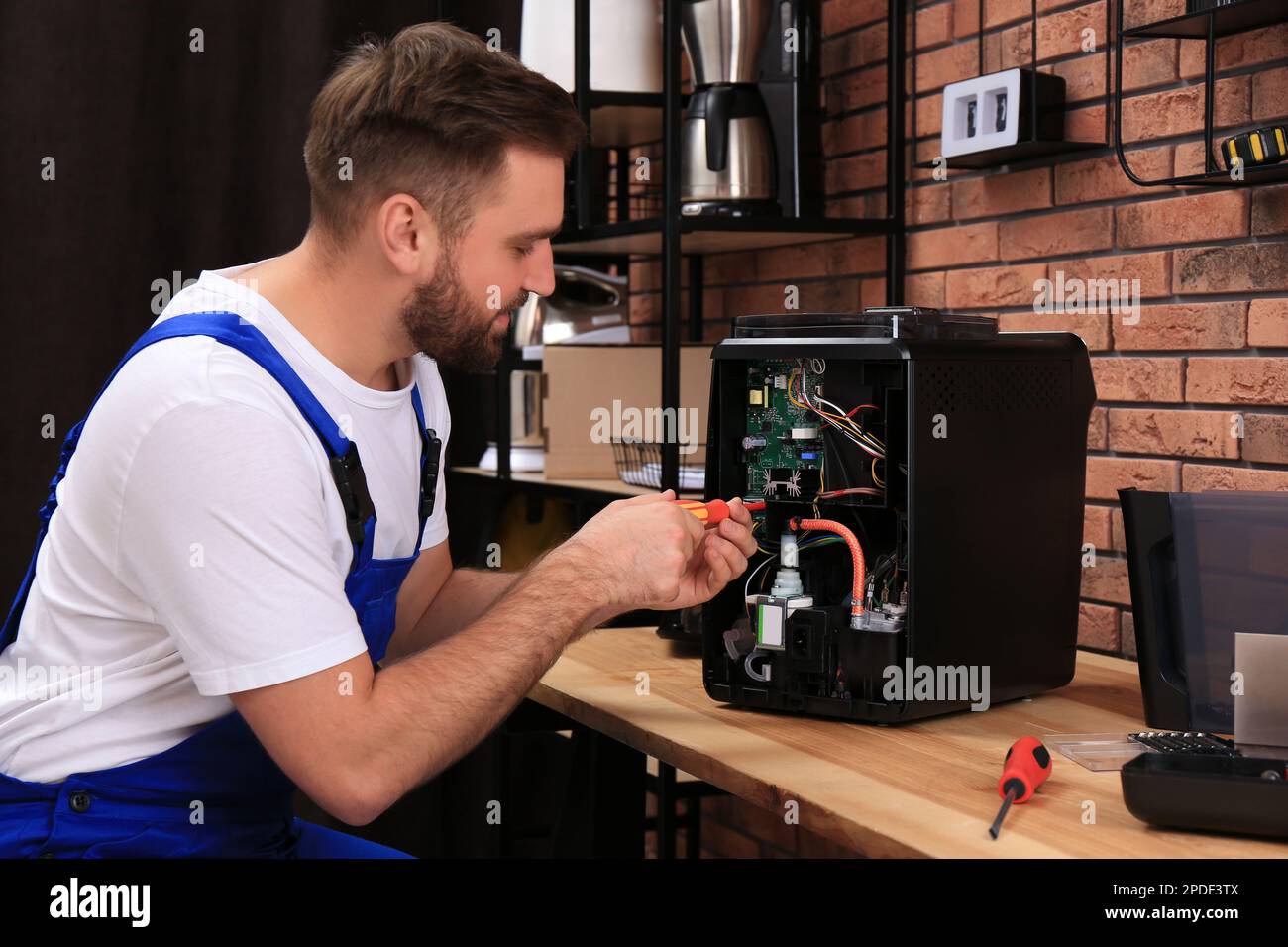 Male repairman coffee machine hi-res stock photography and images - Alamy