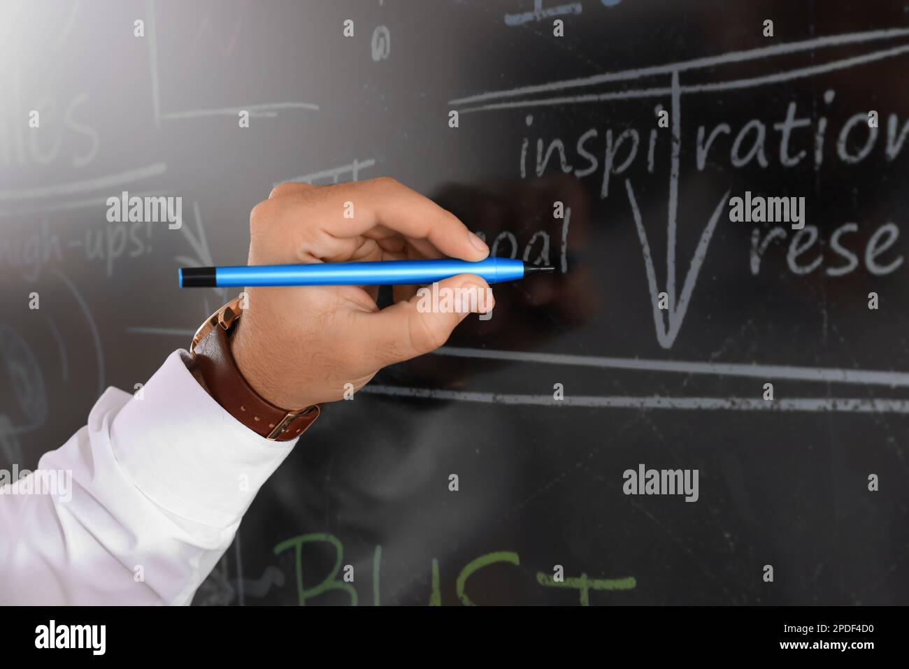 Business trainer with pen using interactive board, closeup Stock Photo