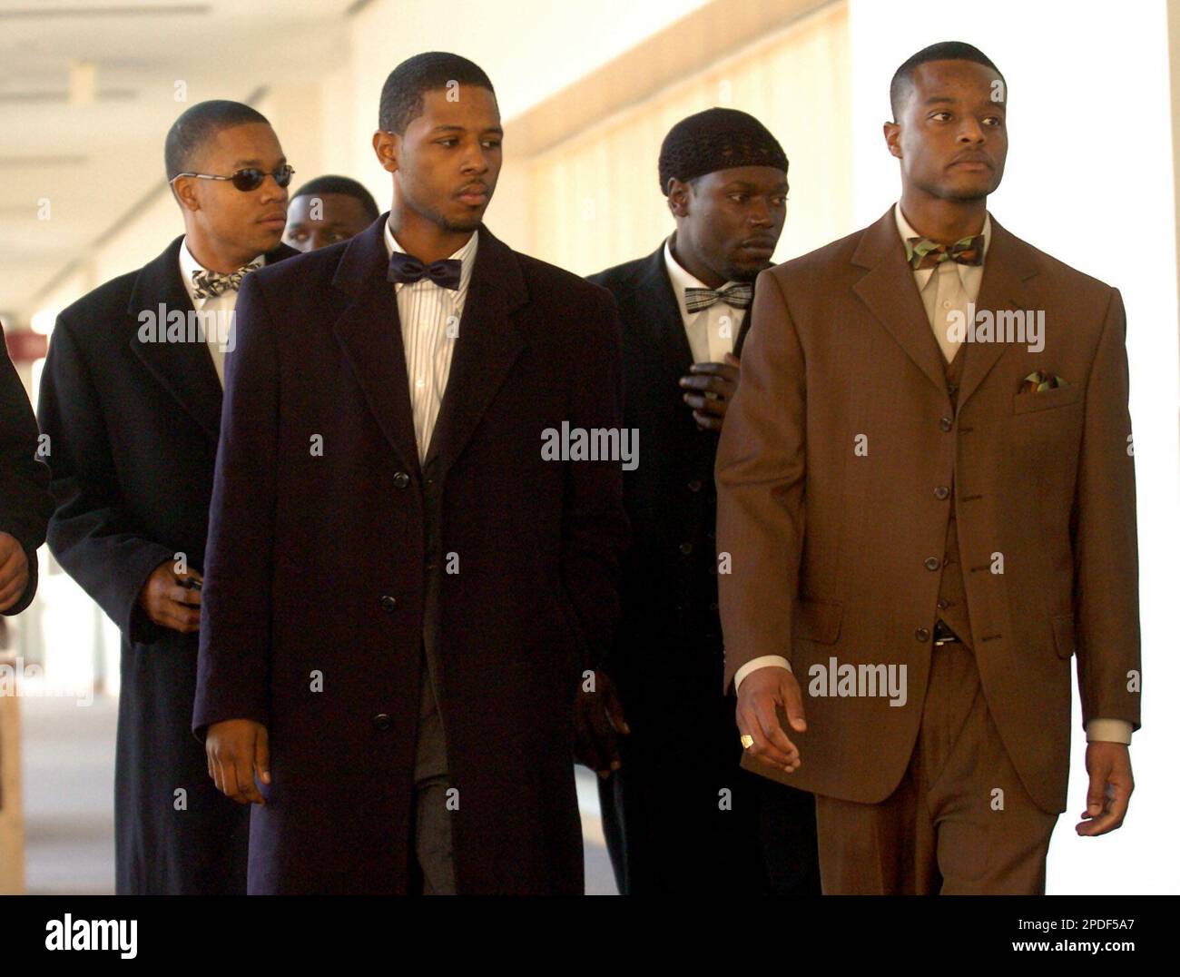 Yusuf Bey IV, 19, left, and Kahlil Ali Raheem, 24, right, walk into ...