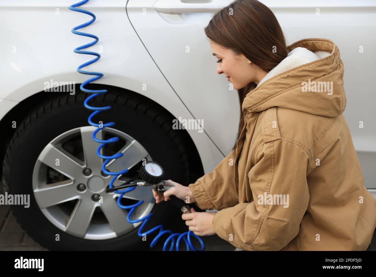 Woman Inflating Car Tyre By Mechanical Foot Air Pump She Does It Herself  Feets In Sandals On The Side Of The Road Stock Photo - Download Image Now -  iStock