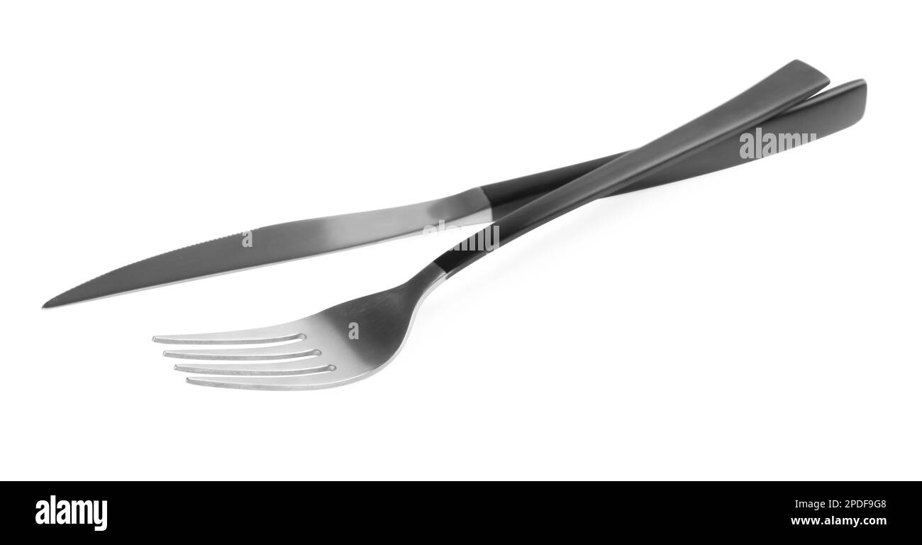 New fork and knife with black handles on white background Stock Photo