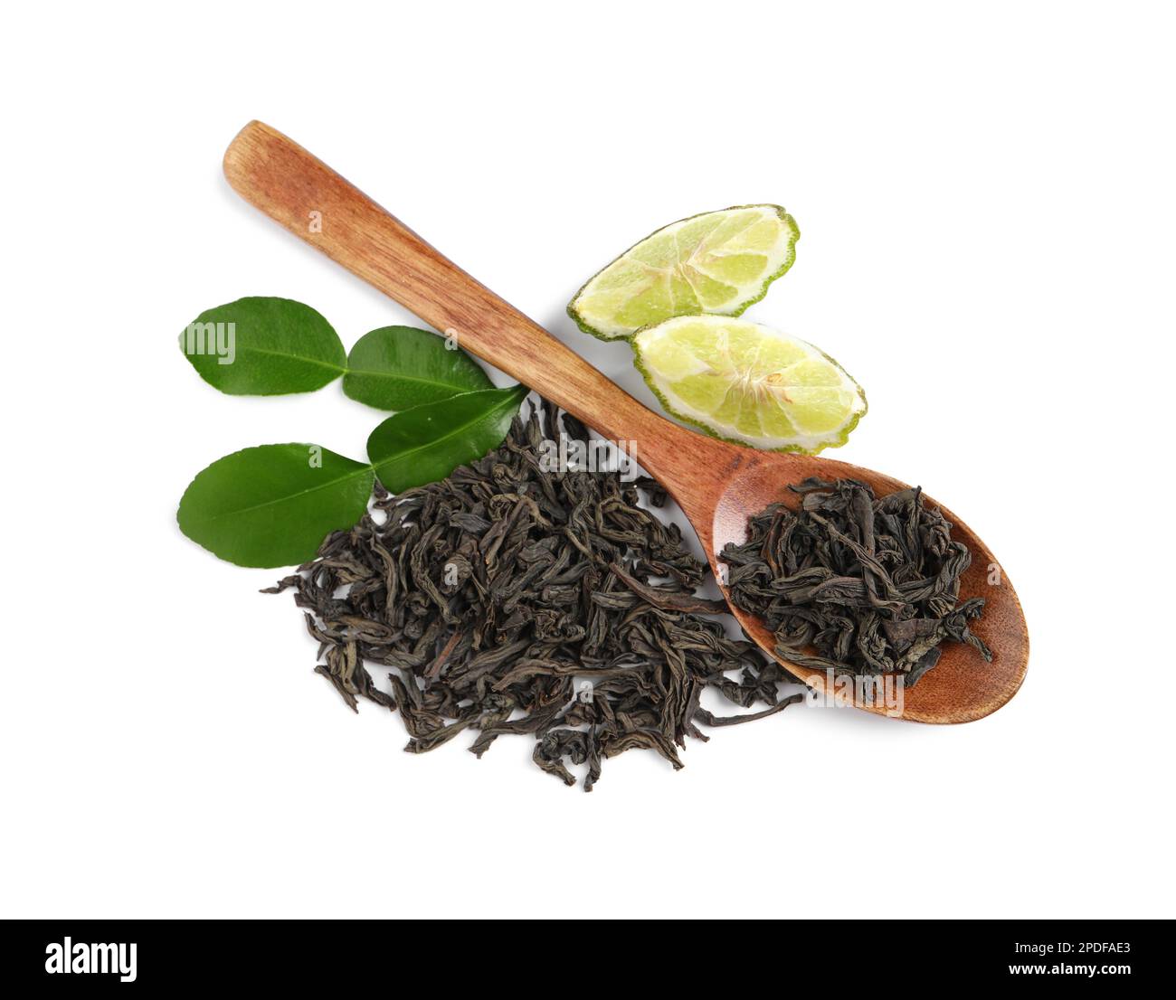 Dry bergamot tea leaves, wooden spoon and fresh fruit on white ...